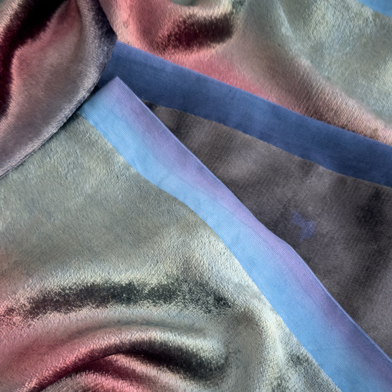 Close-up of fabric. Hand-painted velvet scarf by Otta-Italy, 180 x 20 cm, featuring green, pink and blue navy colors. Luxury Italian velvet scarf, soft and warm scarf for women and men.
