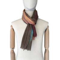 Mannequin wearing scarf on a white background. Hand-painted wool scarf by Otta-Italy, 56 x 177 cm, featuring brown, turquoise, peach colors. Luxury Italian accessory, soft and warm scarf for women and men.
