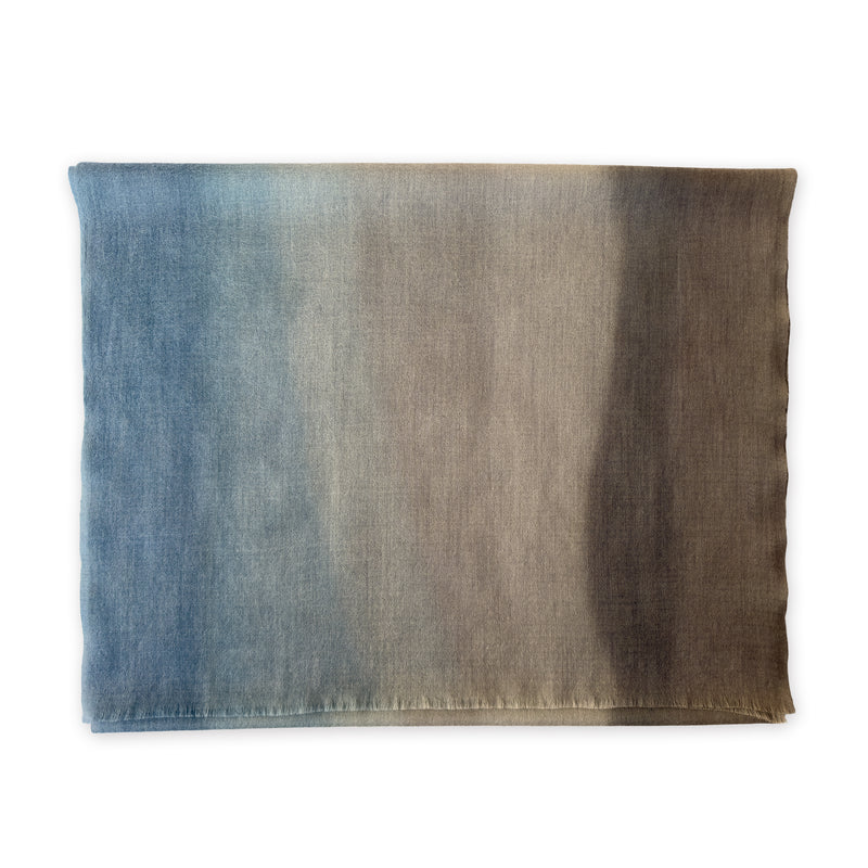 Multicolored wool scarf on a white background. Hand-painted scarf by Otta-Italy, 56 x 177 cm, featuring brown, beige and blue shades of colors. Luxury Italian accessory, soft and warm scarf for women and men.
