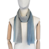 Mannequin wearing scarf on a white background. Hand-painted wool scarf by Otta-Italy, 56 x 177 cm, featuring brown, beige and blue colors. Luxury Italian accessory, soft and warm scarf for women and men.
