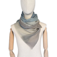 Mannequin wearing scarf on a white background. Hand-painted wool scarf by Otta-Italy, 56 x 177 cm, featuring brown, beige and blue colors. Luxury Italian accessory, soft and warm scarf for women and men.
