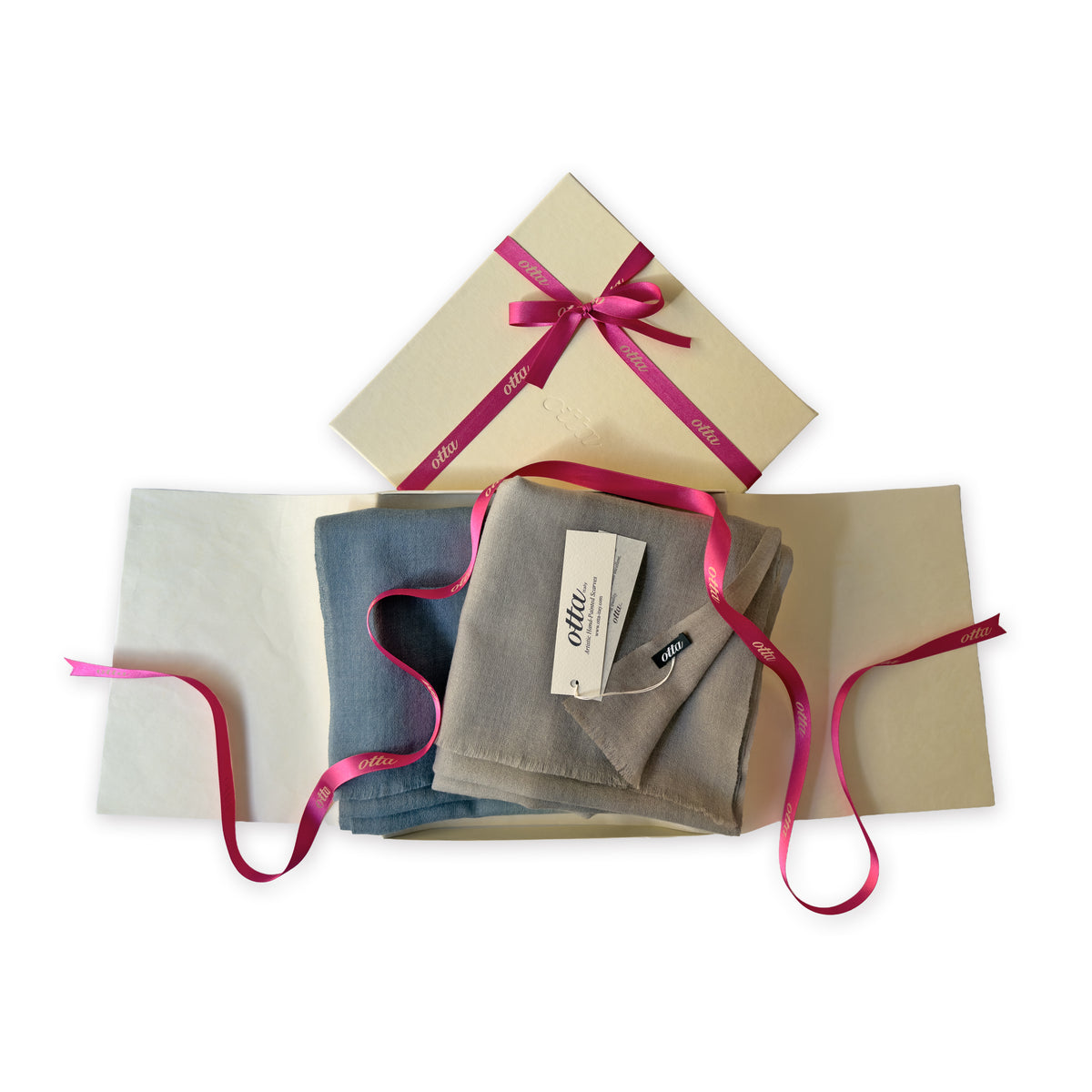 Set of scarves in a gift box with a pink ribbon on a white background. 
Hand-painted wool scarf by Otta-Italy, 56 x 177 cm, featuring brown, beige and blue colors. Luxury Italian accessory, soft and warm scarf for women and men.
