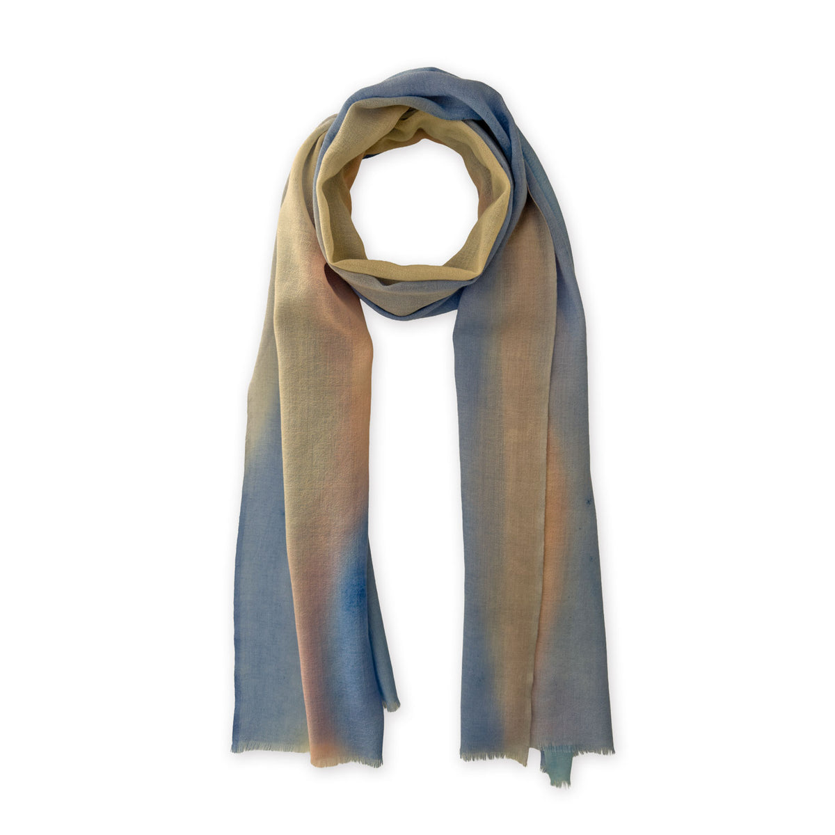 Loosely looped hand-painted Otta wool scarf on a white background, showcasing its warm texture and length. 62 x 203 cm.
