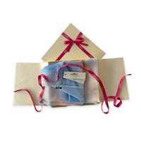 Set of scarves in a gift box with a pink ribbon on a white background. 
Hand-painted wool scarf by Otta-Italy, 61 x 197 cm, featuring 
pastel blue and pink. Luxury Italian pure wool accessory, soft and warm scarf for women and men.
