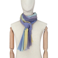 Mannequin wearing scarf on a white background. Hand-painted wool scarf by Otta-Italy, 57 x 180 cm, featuring blue, purple, yellow colors. Luxury Italian accessory, soft and warm scarf for women and men.
