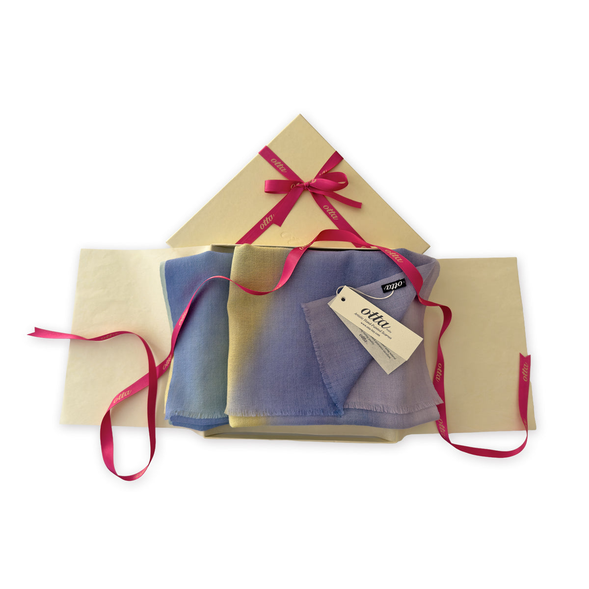 Set of scarves in a gift box with a pink ribbon on a white background. 
Hand-painted wool scarf by Otta-Italy, 57 x 180 cm, featuring blue, purple, yellow colors. Luxury Italian accessory, soft and warm scarf for women and men.
