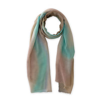 Loosely looped hand-painted Otta wool silk blend scarf on a white background, showcasing its warm texture and length. 69 x 198 cm.
