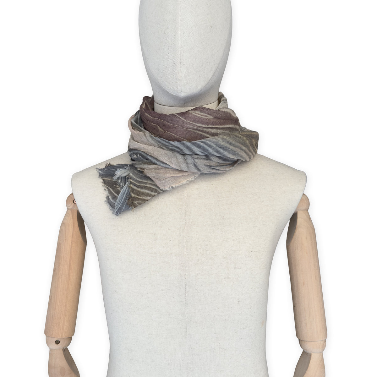 Mannequin wearing scarf on a white background. Hand-painted mix wool and silk scarf by Otta-Italy, 193 x 54 cm, featuring brown, gray and beige colors. Luxury Italian accessory, soft and warm scarf for women and men.
