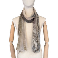 Mannequin wearing scarf on a white background. Hand-painted mix wool and silk scarf by Otta-Italy, 193 x 54 cm, featuring brown, gray and beige colors. Luxury Italian accessory, soft and warm scarf for women and men.

