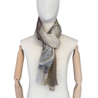 Mannequin wearing scarf on a white background. Hand-painted mix wool and silk scarf by Otta-Italy, 193 x 54 cm, featuring brown, gray and beige colors. Luxury Italian accessory, soft and warm scarf for women and men.
