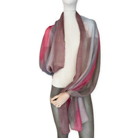 Mannequin wearing scarf on a white background. Hand-painted mix wool and silk scarf by Otta-Italy, 67 x 198 cm, featuring brown, gray and red colors. Luxury Italian accessory, soft and warm scarf for women and men.
