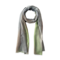 Hand-painted Otta wool & silk scarf in 
brown, gray and light green, loosely looped to showcase its full length and delicate texture in white background. Lightweight artisan accessory with hand-fringed edges, measuring 70 x 197 cm.
