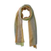 Loosely looped hand-painted Otta wool silk blend scarf on a white background, showcasing its warm texture and length. 71 x 199 cm.
