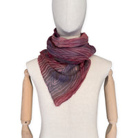 Mannequin wearing scarf on a white background. Hand-painted mix wool and silk scarf by Otta-Italy, 193 x 54 cm, featuring red, purple and dark gray colors. Luxury Italian accessory, soft and warm scarf for women and men.
