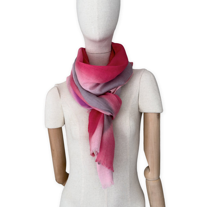 Mannequin wearing scarf on a white background. Hand-painted mix wool and silk scarf by Otta-Italy, 52 x 165 cm, featuring red, pink and gray colors. Luxury Italian accessory, soft and warm scarf for women and men.
