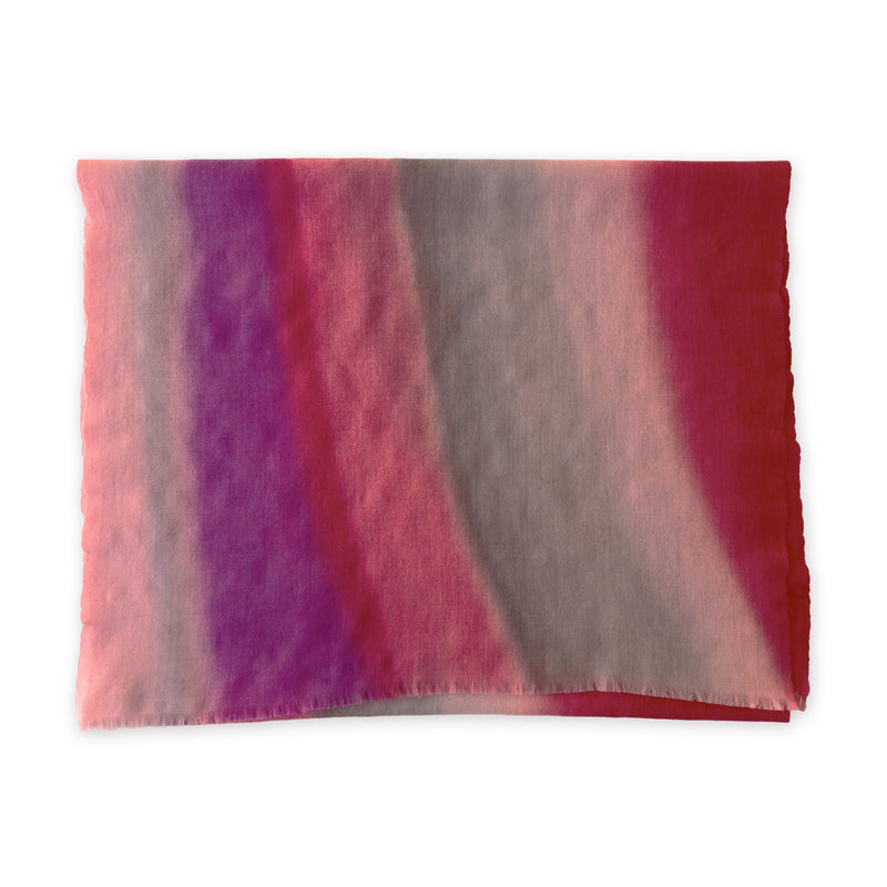 Colorful mix wool and silk scarf in red, pink and gray shades on a white background. It is hand-painted scarf in measures 52 x 165 cm by otta-italy scarves brand. Luxury Italian accessory, soft and warm scarf for women and men.
