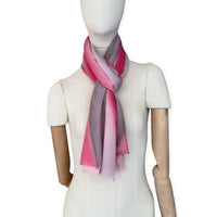 Mannequin wearing scarf on a white background. Hand-painted mix wool and silk scarf by Otta-Italy, 52 x 165 cm, featuring red, pink and gray colors. Luxury Italian accessory, soft and warm scarf for women and men.
