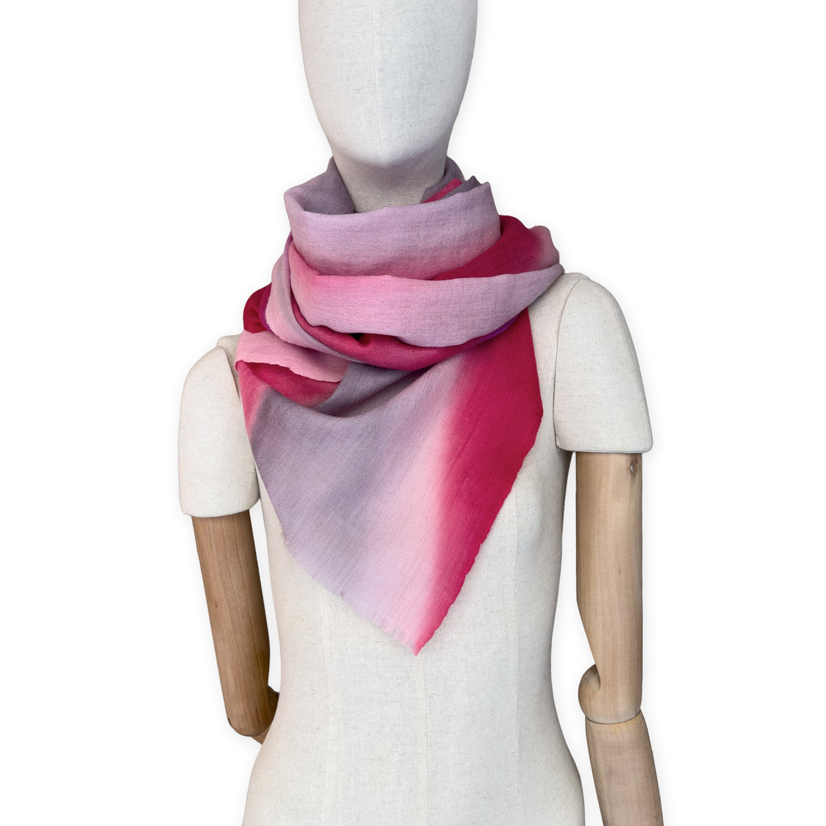 Mannequin wearing scarf on a white background. Hand-painted mix wool and silk scarf by Otta-Italy, 52 x 165 cm, featuring red, pink and gray colors. Luxury Italian accessory, soft and warm scarf for women and men.
