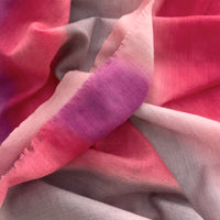 Close-up of soft fabric. Hand-painted mix wool and silk scarf by Otta-Italy, 52 x 165 cm, featuring red, pink and gray colors. Luxury Italian mix accessory, soft and warm scarf for women and men.

